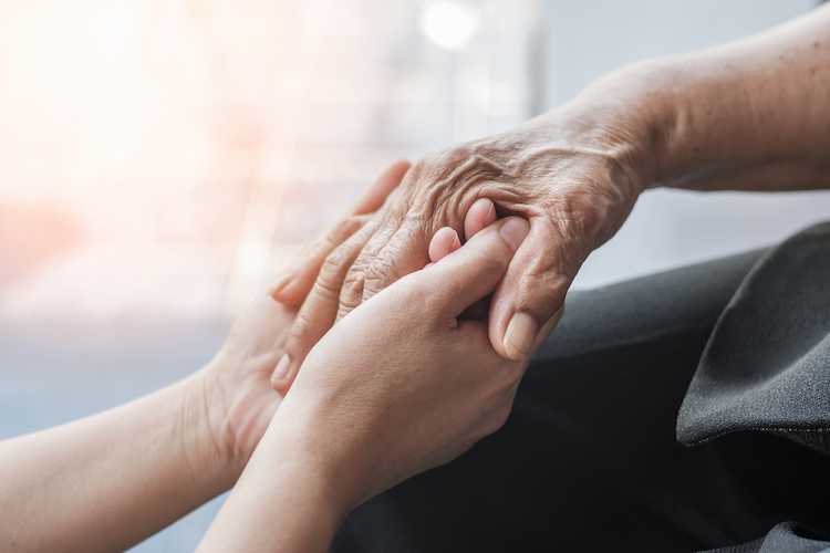 Parkinson disease patient, Alzheimer elderly senior, Arthritis person hand in support of nursing family caregiver care for disability awareness day, National care givers month, ageing society concept (Parkinson disease patient, Alzheimer elderly senio